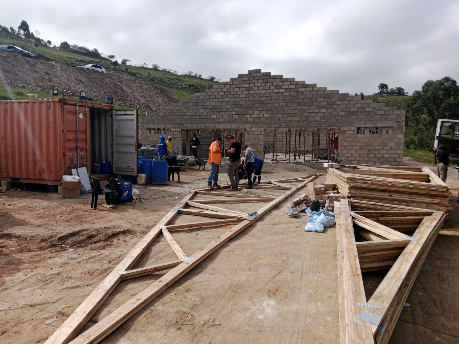 Timber roof trusses being installed on a house in KwaZulu-Natal