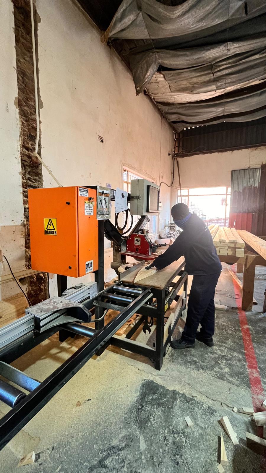 Cutting timber at the saw station
