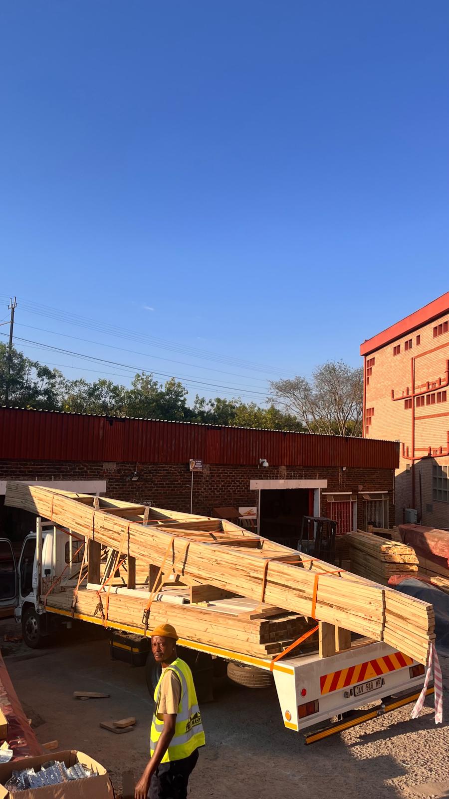 A trailer load of finished roof trusses leaving the Mbombela plant